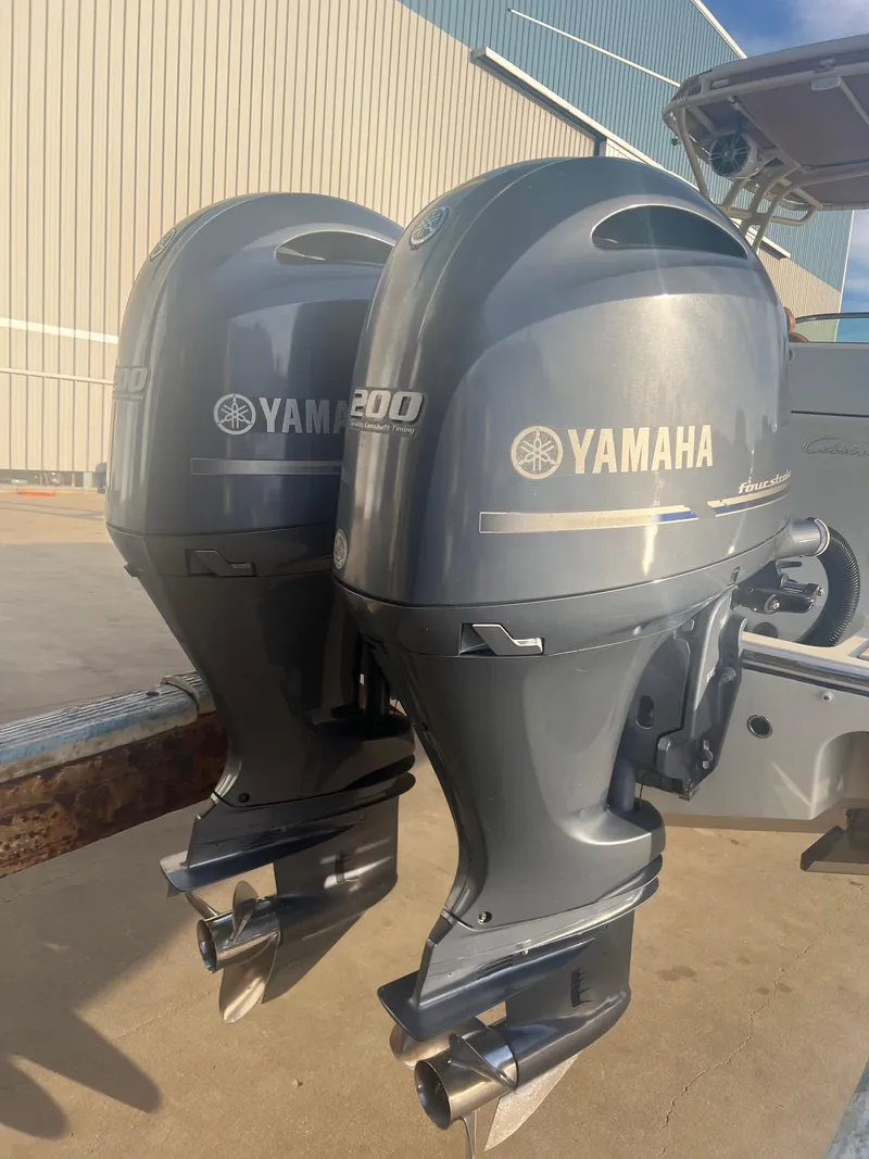 Slide: The Image of Twin Yamaha 200 outboard motors on a 2017 Chris-Craft Calypso boat. - 4