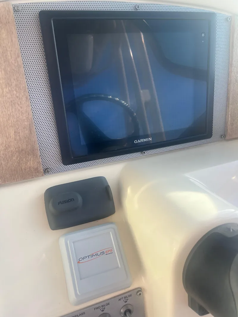 Slide: The Image of 2017 Chris-Craft Calypso dashboard with Garmin navigation system. - 9