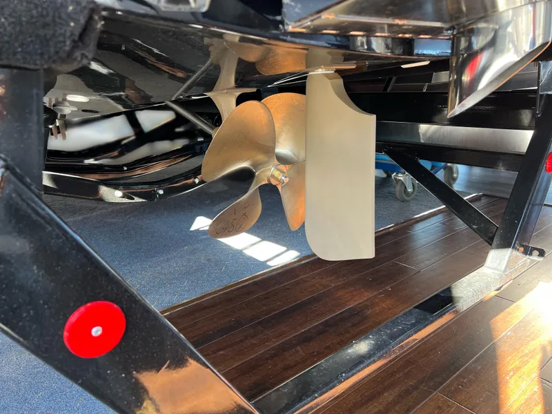 Slide: The Image of Close-up of 2025 MasterCraft X22 boat propeller and rudder. - 18