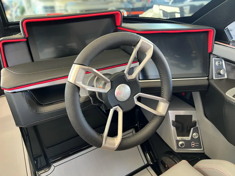 Slide: The Image of 2025 MasterCraft X22 boat steering wheel and dashboard, featuring modern design and controls. - 21