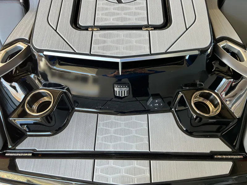 Slide: The Image of 2025 MasterCraft X22 boat deck with sleek design and cup holders. - 3