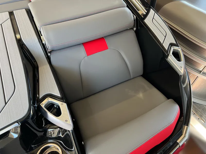 Slide: The Image of 2025 MasterCraft X22 boat seat with gray and red upholstery. - 4