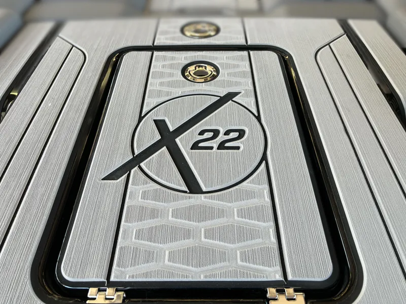 Slide: The Image of 2025 MasterCraft X22 boat deck with sleek design and logo. - 6