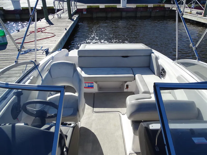 Slide: The Image of 2021 Regal 1900 ES Bowrider interior, docked by the water. - 4