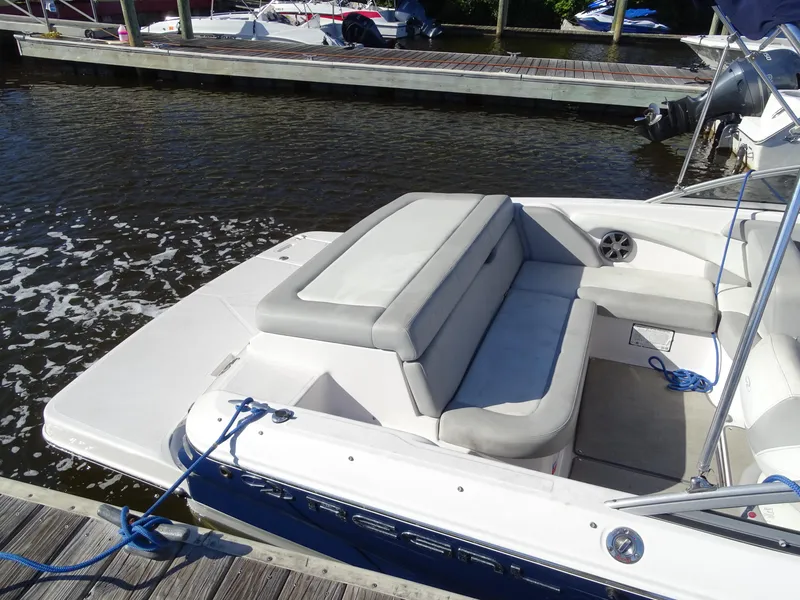 Slide: The Image of 2021 Regal 1900 ES Bowrider docked, featuring spacious seating and sleek design. - 5