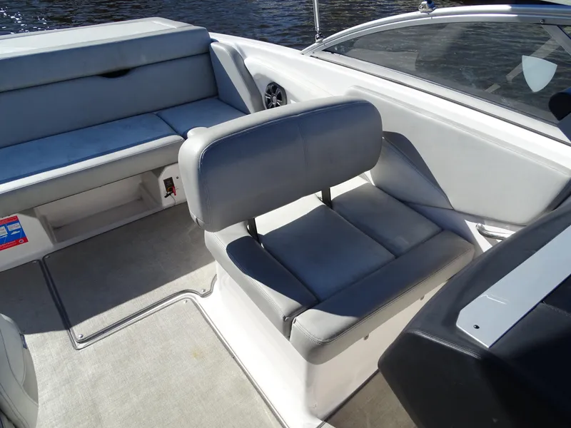 Slide: The Image of 2021 Regal 1900 ES Bowrider interior with gray seating and spacious layout. - 6