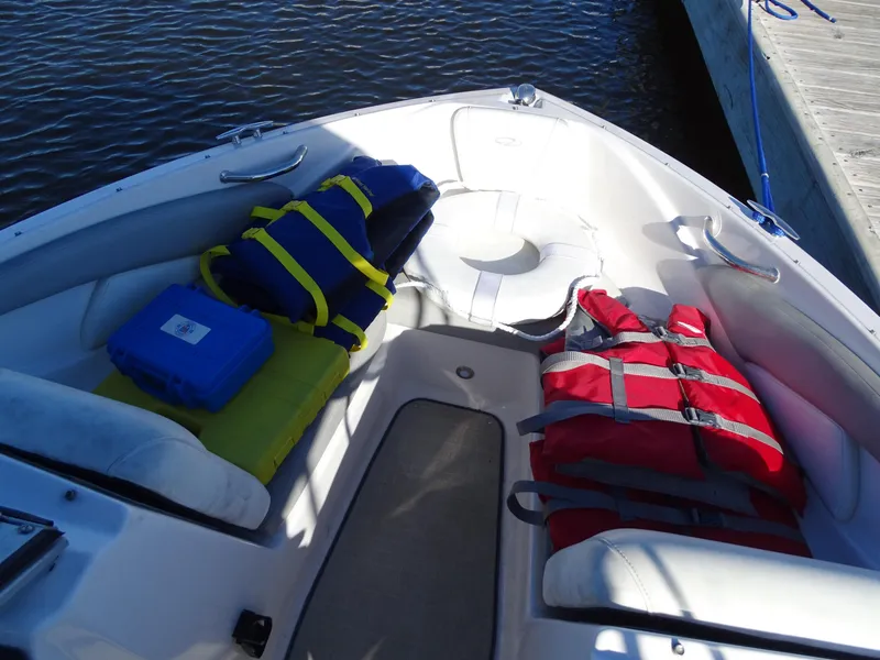 Slide: The Image of 2021 Regal 1900 ES Bowrider with life jackets and gear on deck. - 9