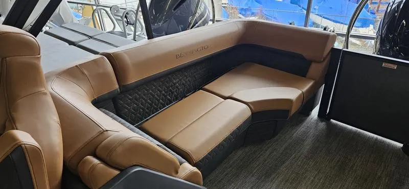 Slide: The Image of Luxurious seating in 2025 Bennington 24 MFB boat with brown leather upholstery. - 10