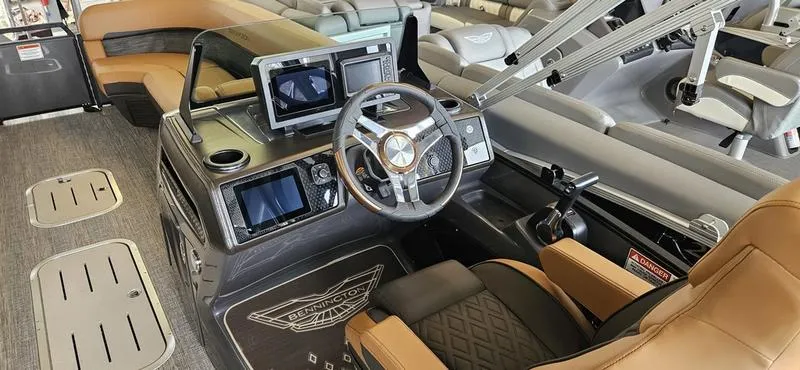 Slide: The Image of Interior of 2025 Bennington 24 MFB boat with modern dashboard and seating. - 11