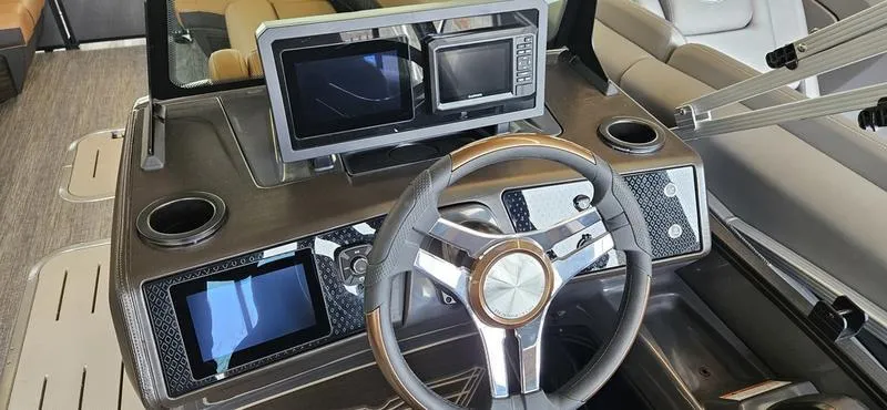 Slide: The Image of Dashboard of 2025 Bennington 24 MFB boat with modern steering and digital displays. - 12