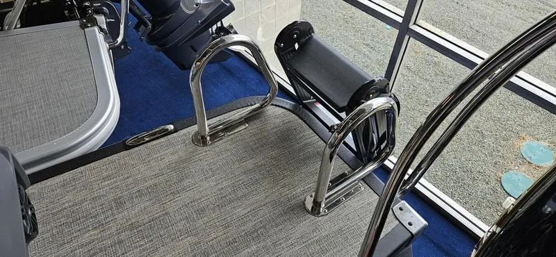 Slide: The Image of Interior of 2025 Bennington 24 MFB boat with chrome details and carpeted flooring. - 14