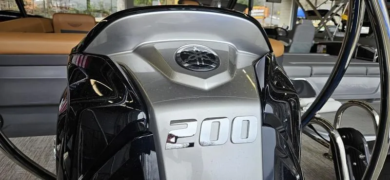 Slide: The Image of 2025 Bennington 24 MFB boat with a 200 horsepower engine, sleek design. - 15