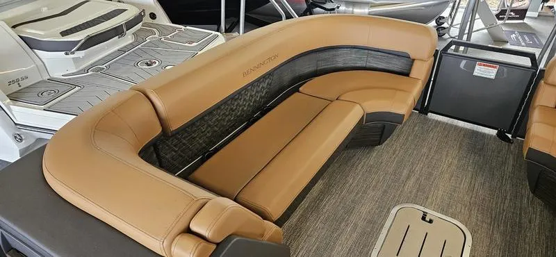 Slide: The Image of 2025 Bennington 24 MFB boat interior with tan leather seating and modern design. - 3