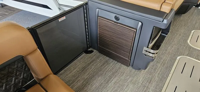 Slide: The Image of 2025 Bennington 24 MFB interior with brown seating and modern design. - 6