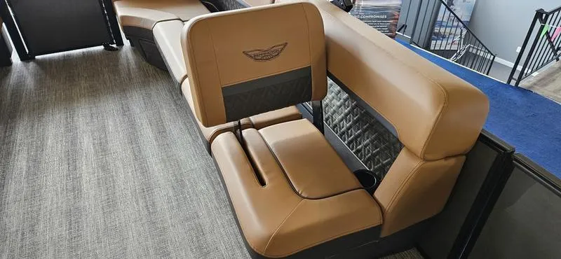 Slide: The Image of 2025 Bennington 24 MFB boat interior with tan leather seating and modern design. - 8