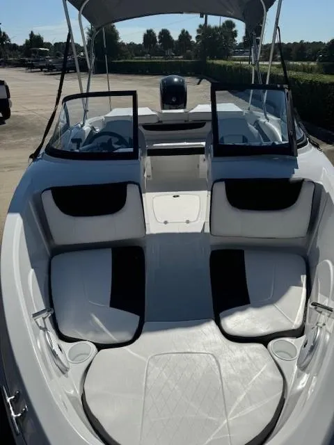 Slide: The Image of 2025 Tahoe 200 S boat interior with open seating and canopy. - 3
