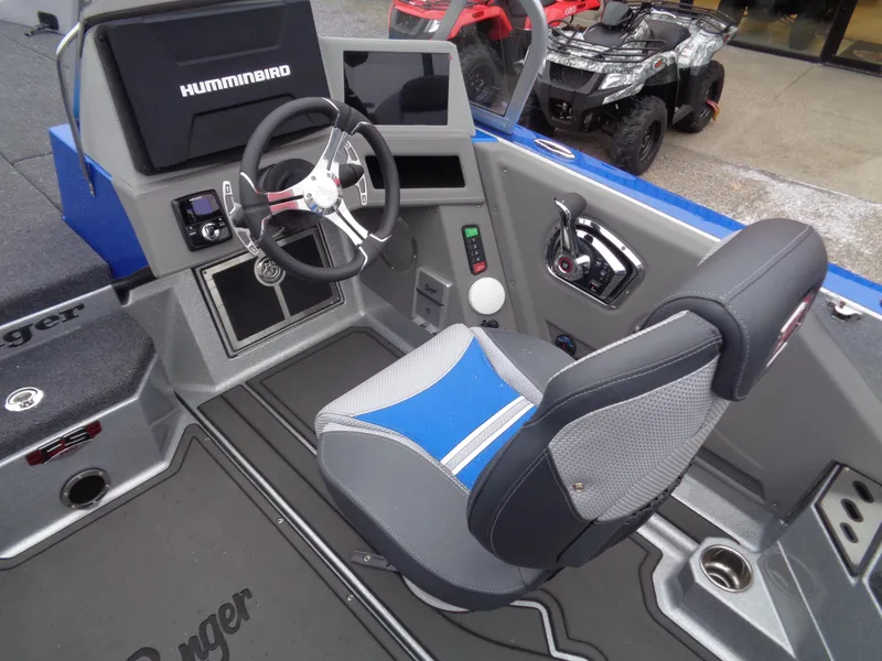 Slide: The Image of 2024 Ranger 622FS Pro boat cockpit with steering wheel and seat. - 11