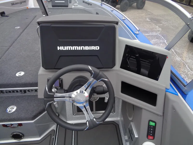 Slide: The Image of 2024 Ranger 622FS Pro boat dashboard with Humminbird electronics and steering wheel. - 12
