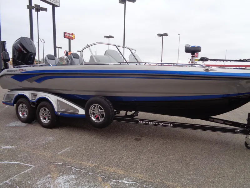 Slide: The Image of 2024 Ranger 622FS Pro boat on trailer, gray and blue design. - 4