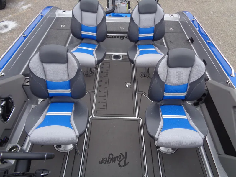 Slide: The Image of 2024 Ranger 622FS Pro boat interior with four blue and gray seats. - 8