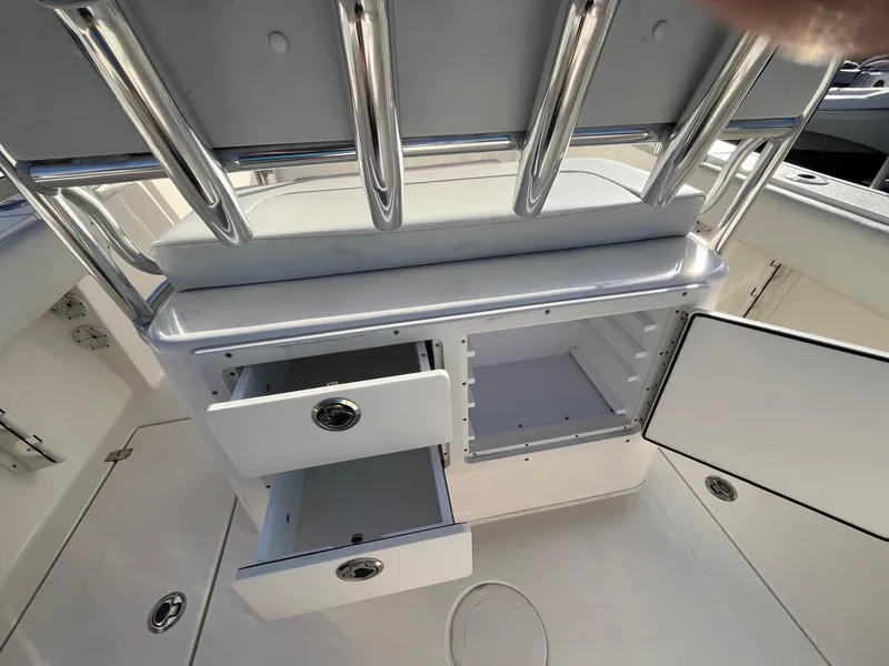 Slide: The Image of 2022 Cobia 237 Center Console boat storage compartments and drawers. - 7