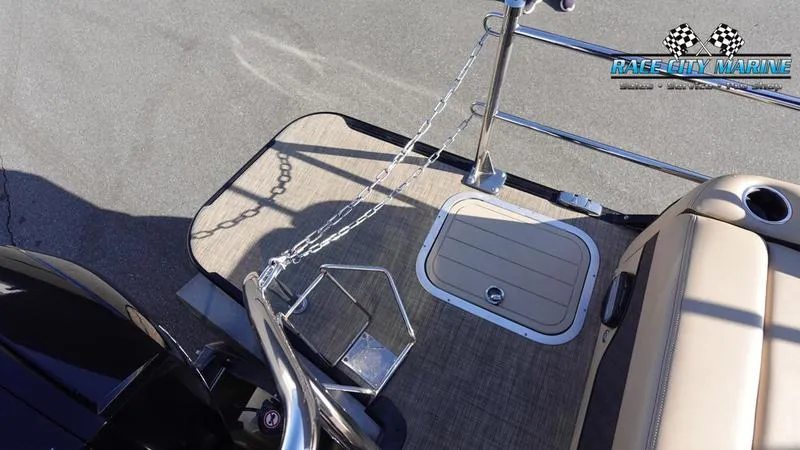 Slide: The Image of 2020 Barletta L23UC boat deck with chain railing and storage hatch. - 10