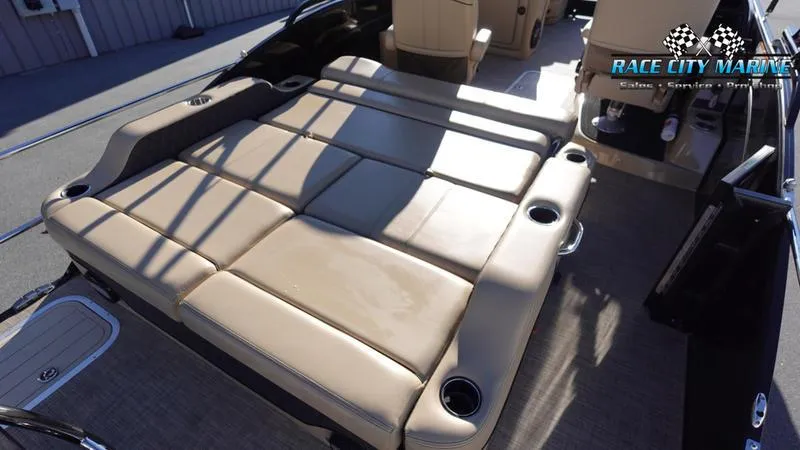 Slide: The Image of 2020 Barletta L23UC pontoon boat with spacious tan seating and cup holders. - 13