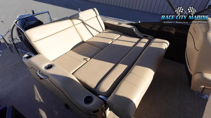 Slide: The Image of 2020 Barletta L23UC boat with beige seating and cup holders. - 16