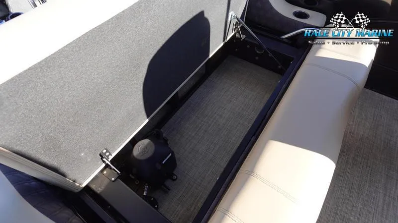 Slide: The Image of 2020 Barletta L23UC boat interior storage compartment with beige seating. - 18