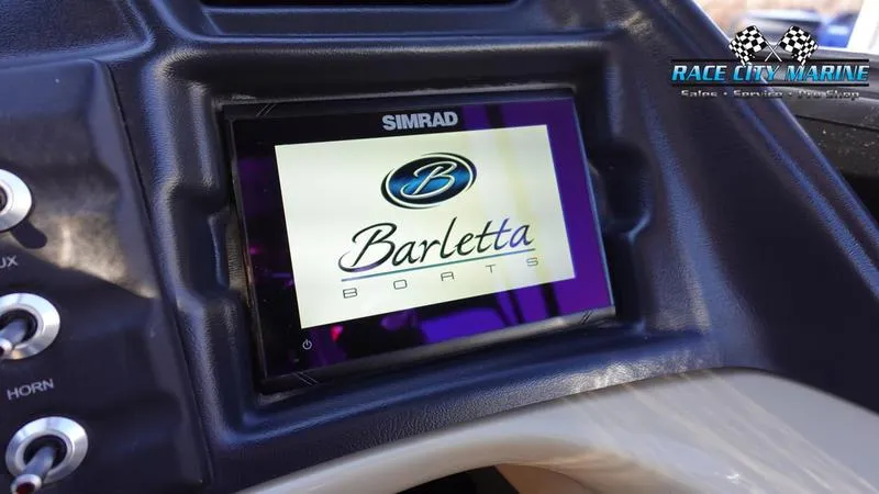 Slide: The Image of Simrad display on 2020 Barletta L23UC boat dashboard, Race City Marine logo visible. - 29