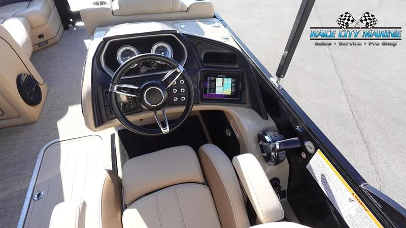 Slide: The Image of 2020 Barletta L23UC boat dashboard with steering wheel and navigation display. - 34