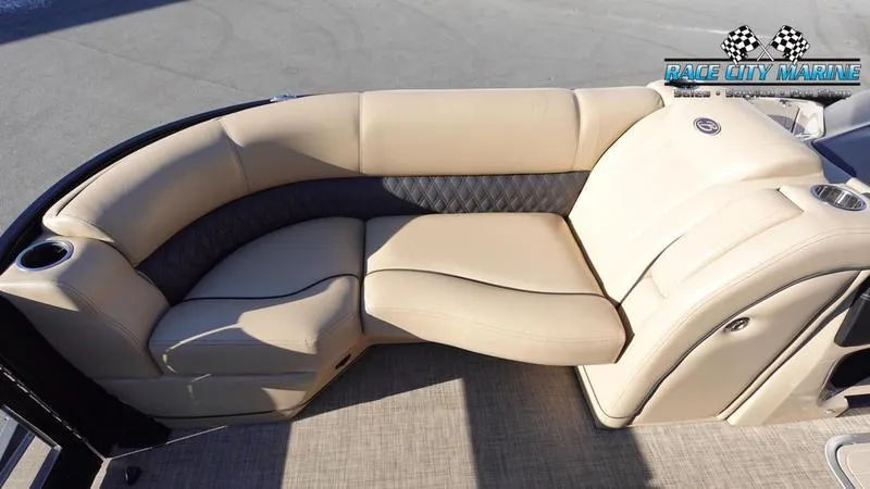 Slide: The Image of 2020 Barletta L23UC pontoon boat with beige seating and cup holders. - 36