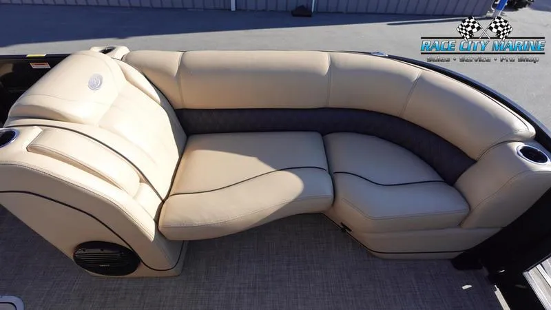 Slide: The Image of 2020 Barletta L23UC boat interior with beige seating and cup holders. - 37