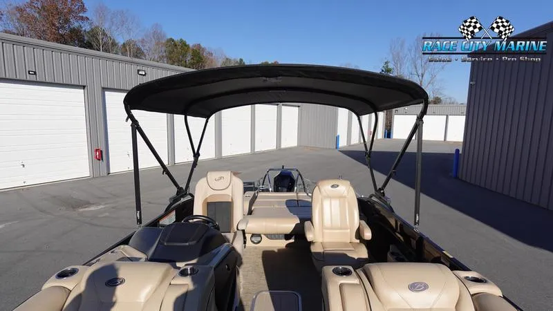 Slide: The Image of 2020 Barletta L23UC pontoon boat with canopy, parked at Race City Marine. - 42