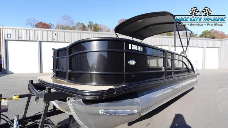 Slide: The Image of 2020 Barletta L23UC pontoon boat with black exterior, parked at Race City Marine. - 6