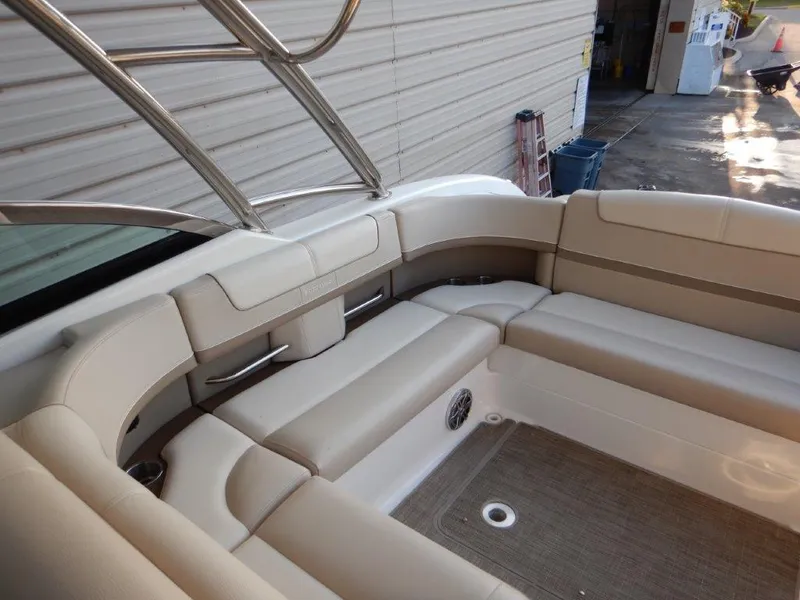 Slide: The Image of 2016 Formula 350 Crossover Bowrider interior with beige seating and stainless steel accents. - 10