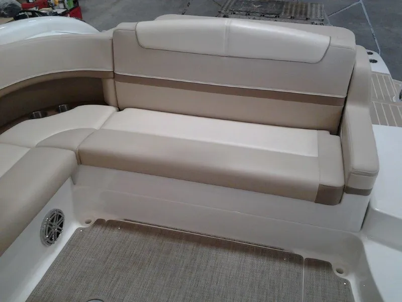 Slide: The Image of 2016 Formula 350 Crossover Bowrider interior with beige seating and carpeted flooring. - 17