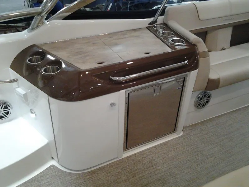 Slide: The Image of 2016 Formula 350 Crossover Bowrider interior with sleek seating and built-in amenities. - 18