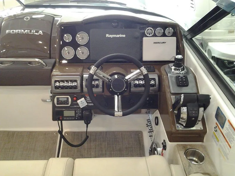 Slide: The Image of 2016 Formula 350 Crossover Bowrider dashboard with steering wheel and navigation controls. - 19
