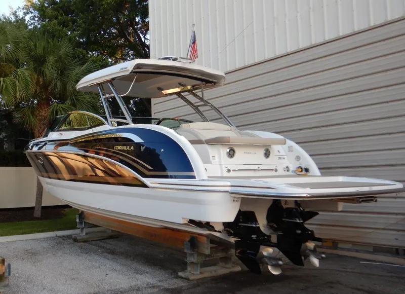 Slide: The Image of 2016 Formula 350 Crossover Bowrider boat on display, featuring sleek design and dual engines. - 2