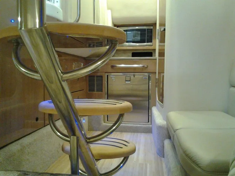 Slide: The Image of Interior of 2016 Formula 350 Crossover Bowrider with modern kitchen and spiral staircase. - 21