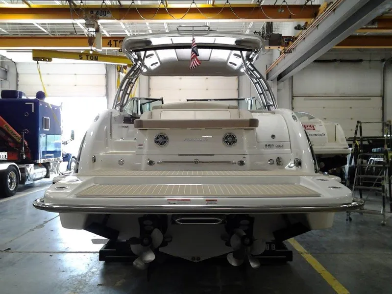 Slide: The Image of 2016 Formula 350 Crossover Bowrider in a garage, rear view with swim platform. - 3