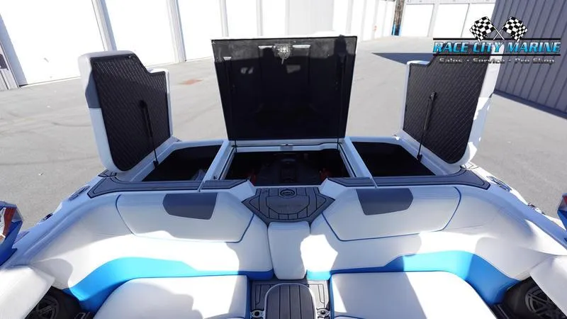 Slide: The Image of 2019 Nautique Super Air Nautique GS20 interior with open storage compartments. - 16