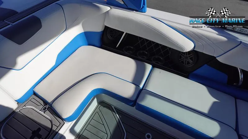 Slide: The Image of 2019 Nautique Super Air Nautique GS20 interior with blue and white seating. - 21