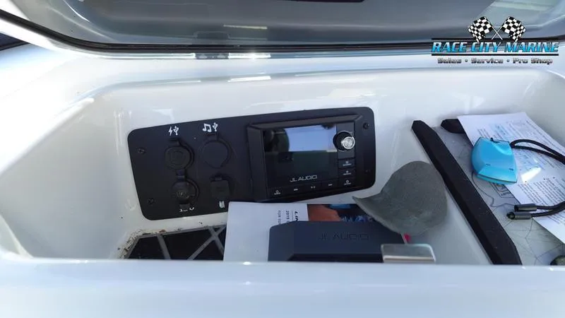 Slide: The Image of 2019 Nautique Super Air Nautique GS20 dashboard with JL Audio system and accessories. - 28