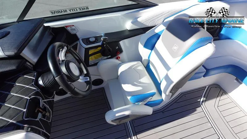 Slide: The Image of 2019 Nautique Super Air Nautique GS20 interior with steering wheel and captain's seat. - 29