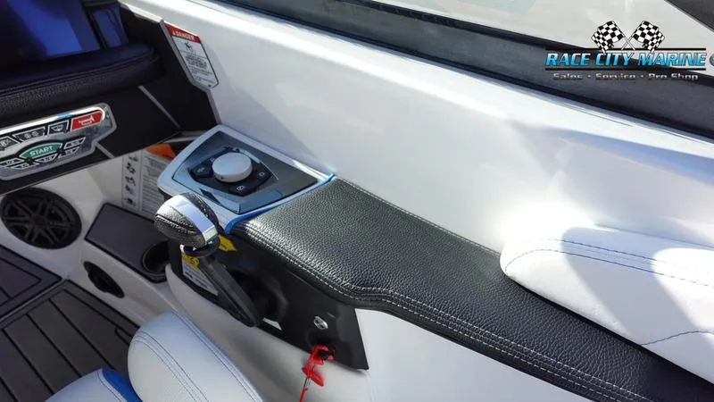 Slide: The Image of 2019 Nautique Super Air Nautique GS20 boat interior with control panel and seating. - 31