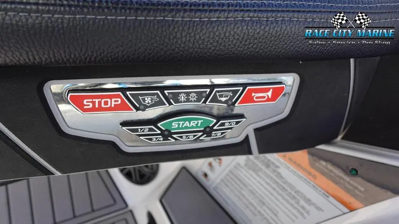 Slide: The Image of Control panel of 2019 Nautique Super Air Nautique GS20 boat with start and stop buttons. - 33