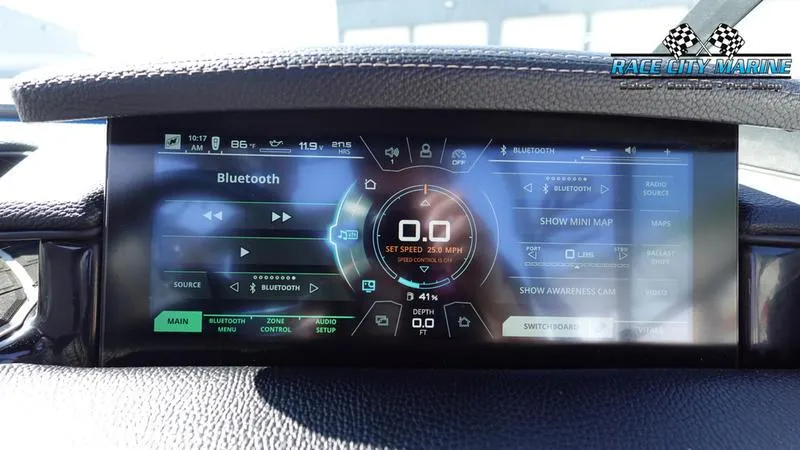 Slide: The Image of 2019 Nautique Super Air Nautique GS20 dashboard with digital display and Bluetooth controls. - 36