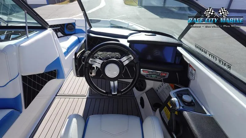 Slide: The Image of 2019 Nautique Super Air Nautique GS20 boat interior with steering wheel and dashboard. - 37